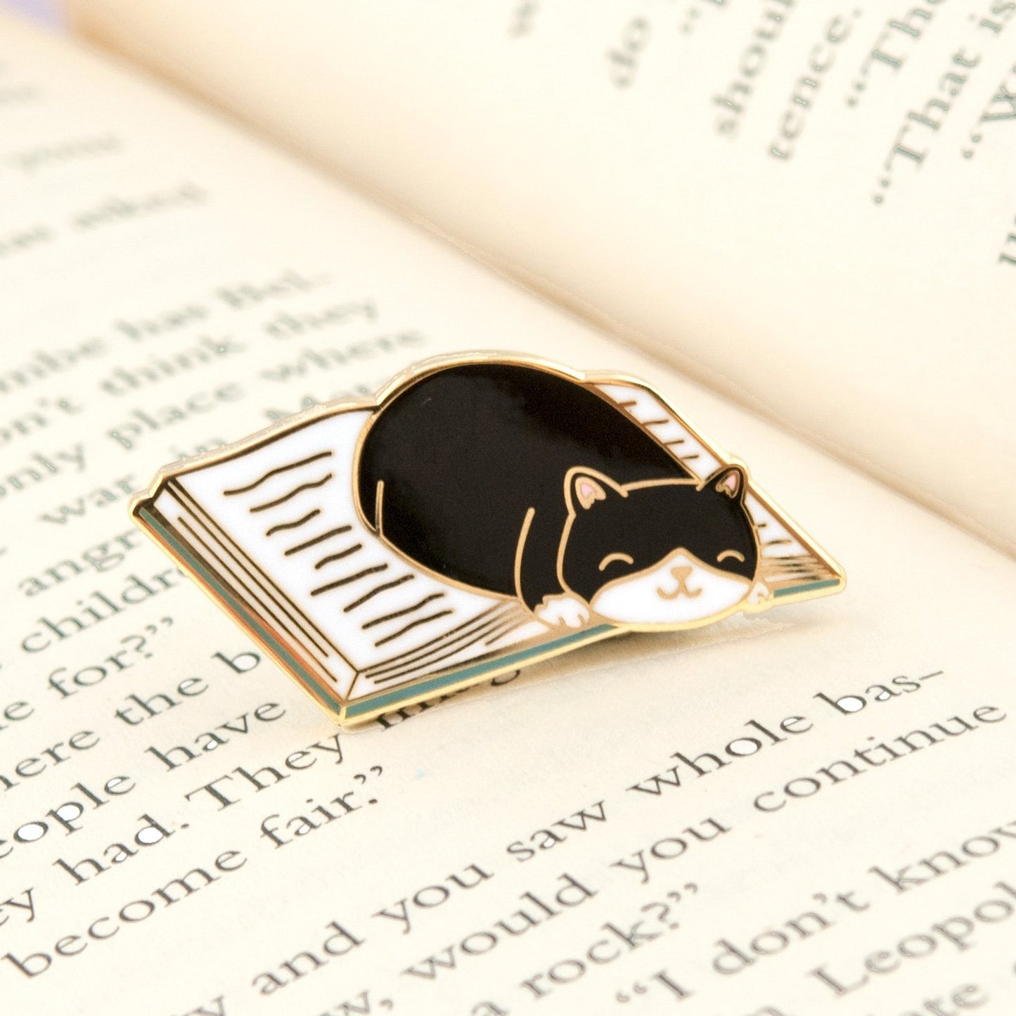 cat curled up in a good book enamel pin - the salty hive