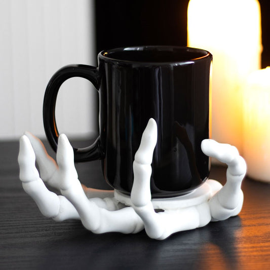 skeleton hand candle holder